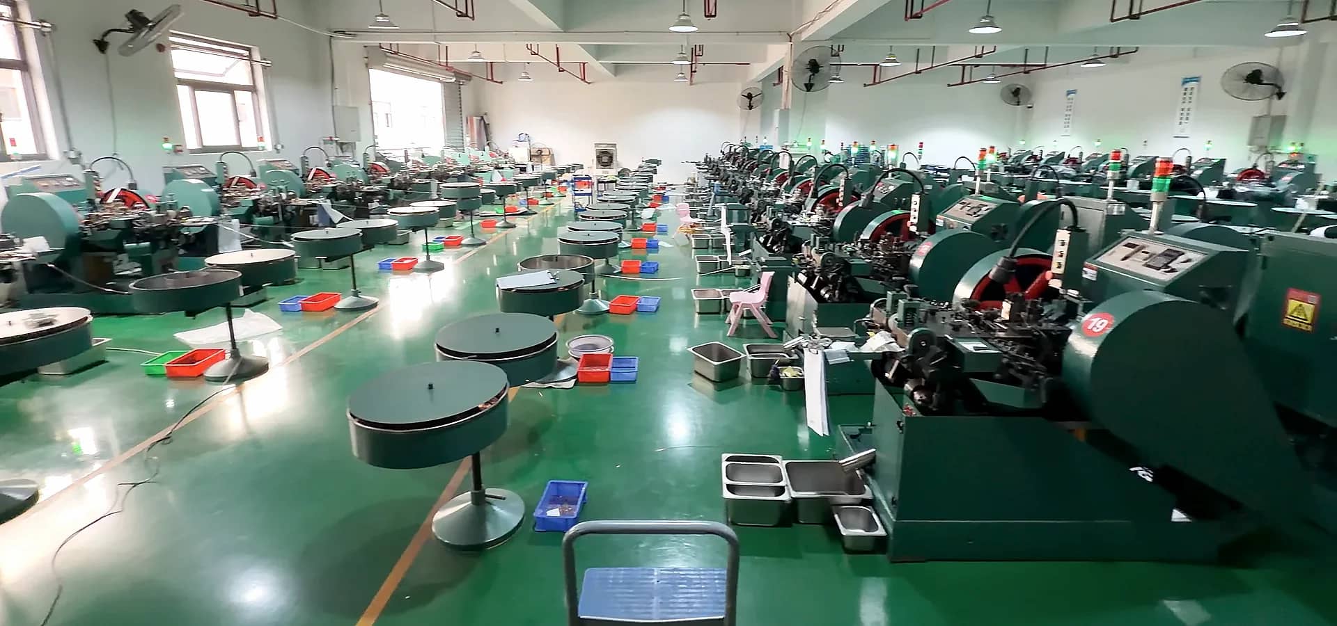 A photographed manufacturing work area with forming equipment.