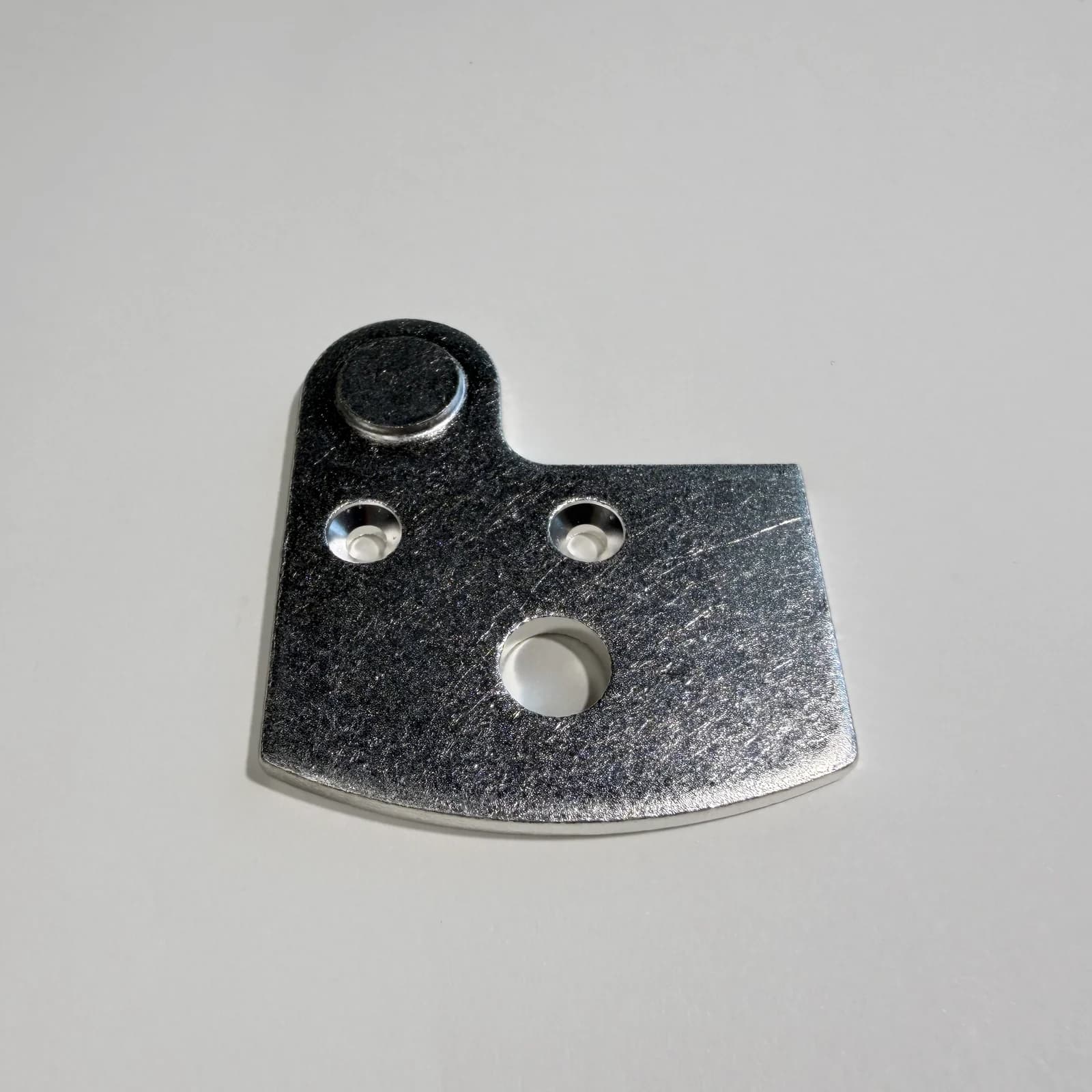 Custom welded electrical contact assemblies shown on a light neutral background.