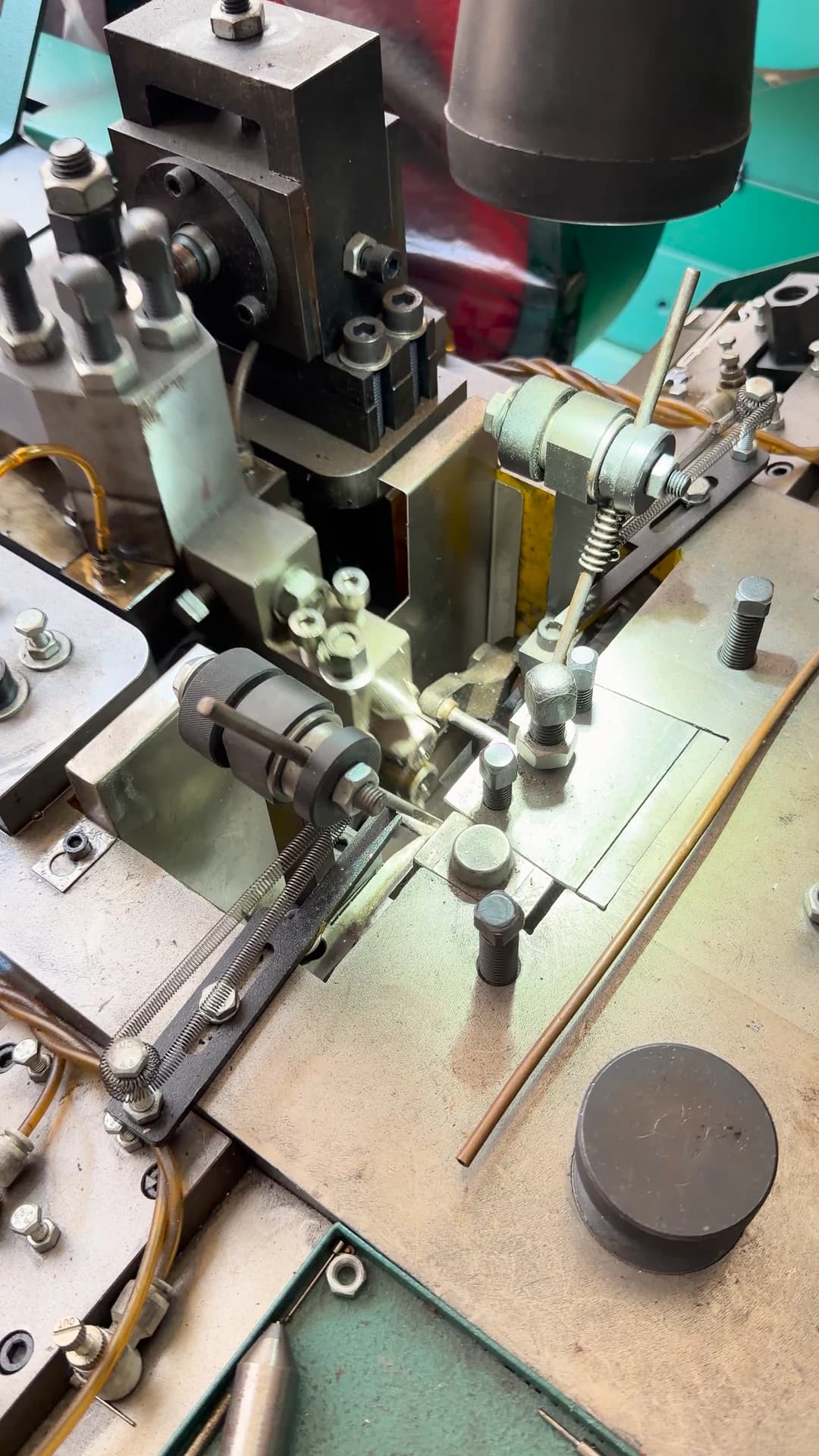A close view of mechanical movement at a production workstation.
