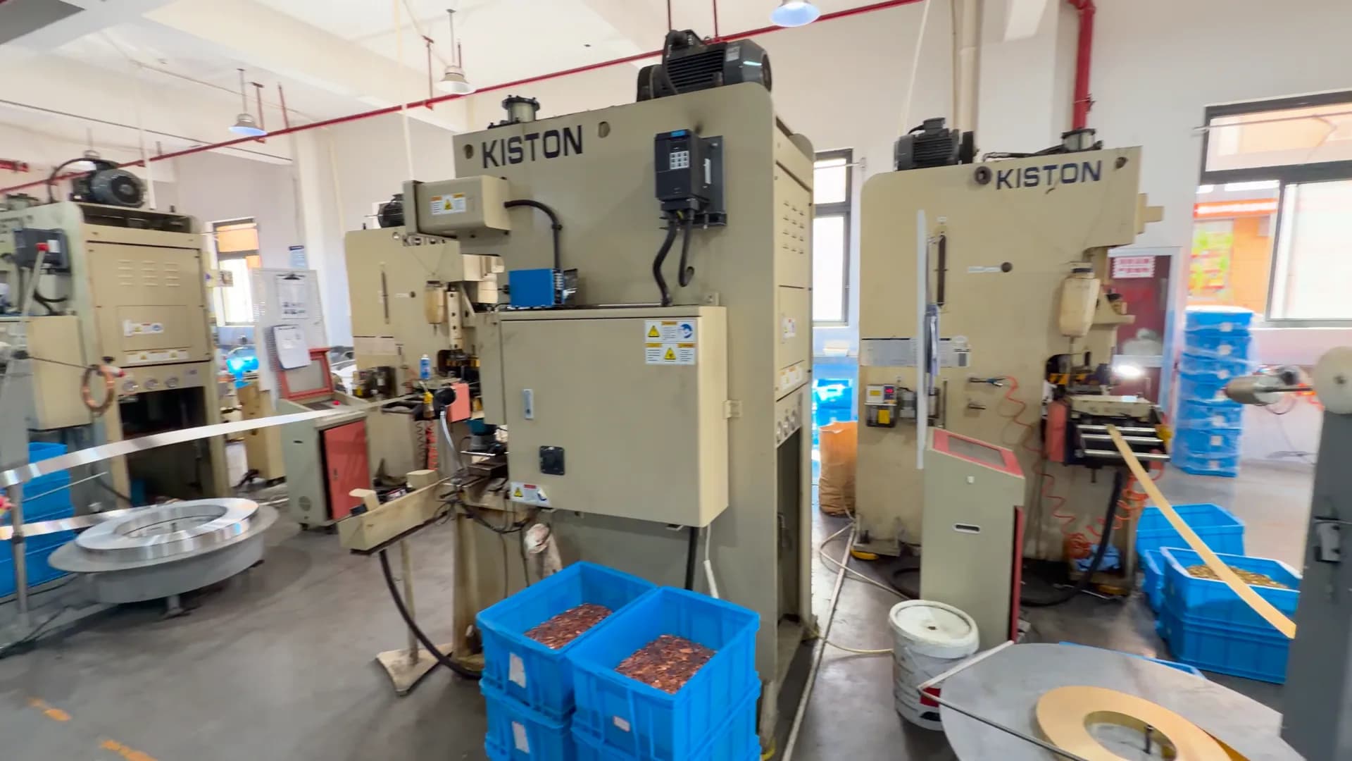 Wide view of production equipment, workstations and material handling stations.