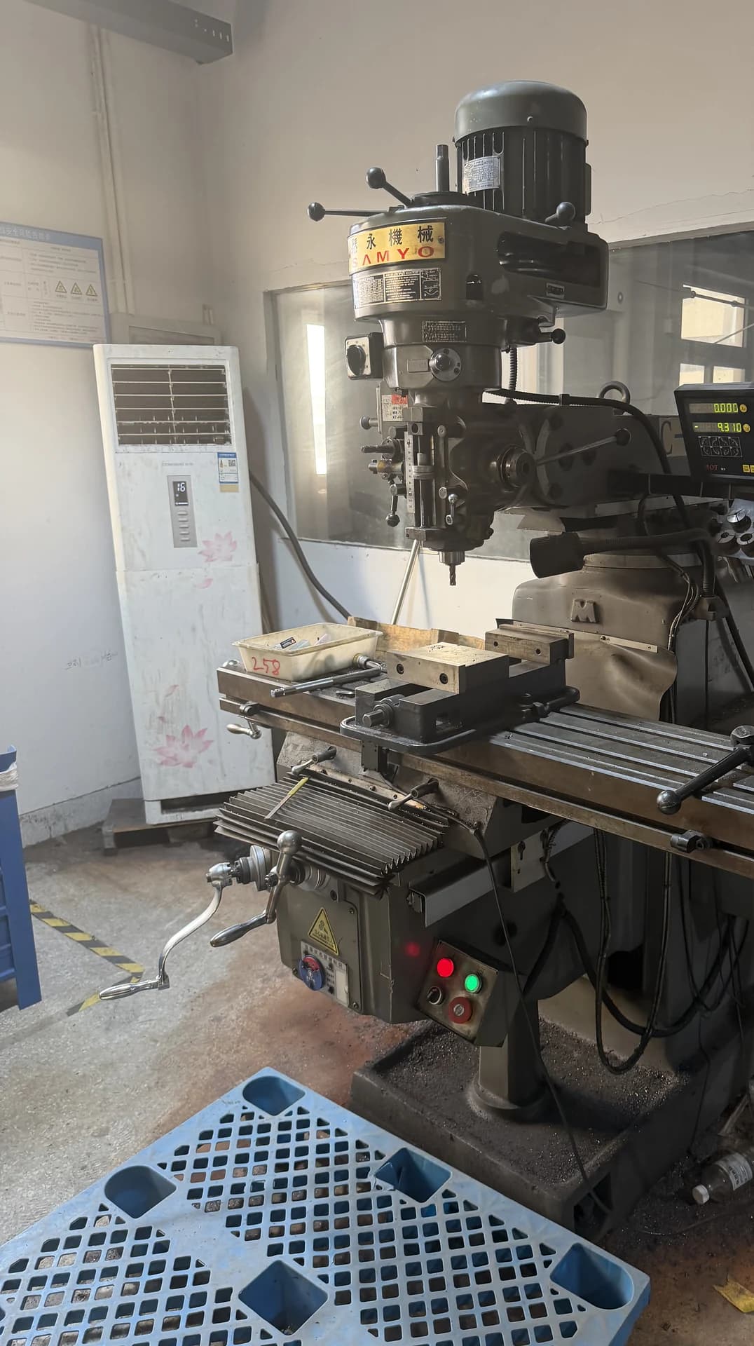 Vertical view of production equipment and a workstation.
