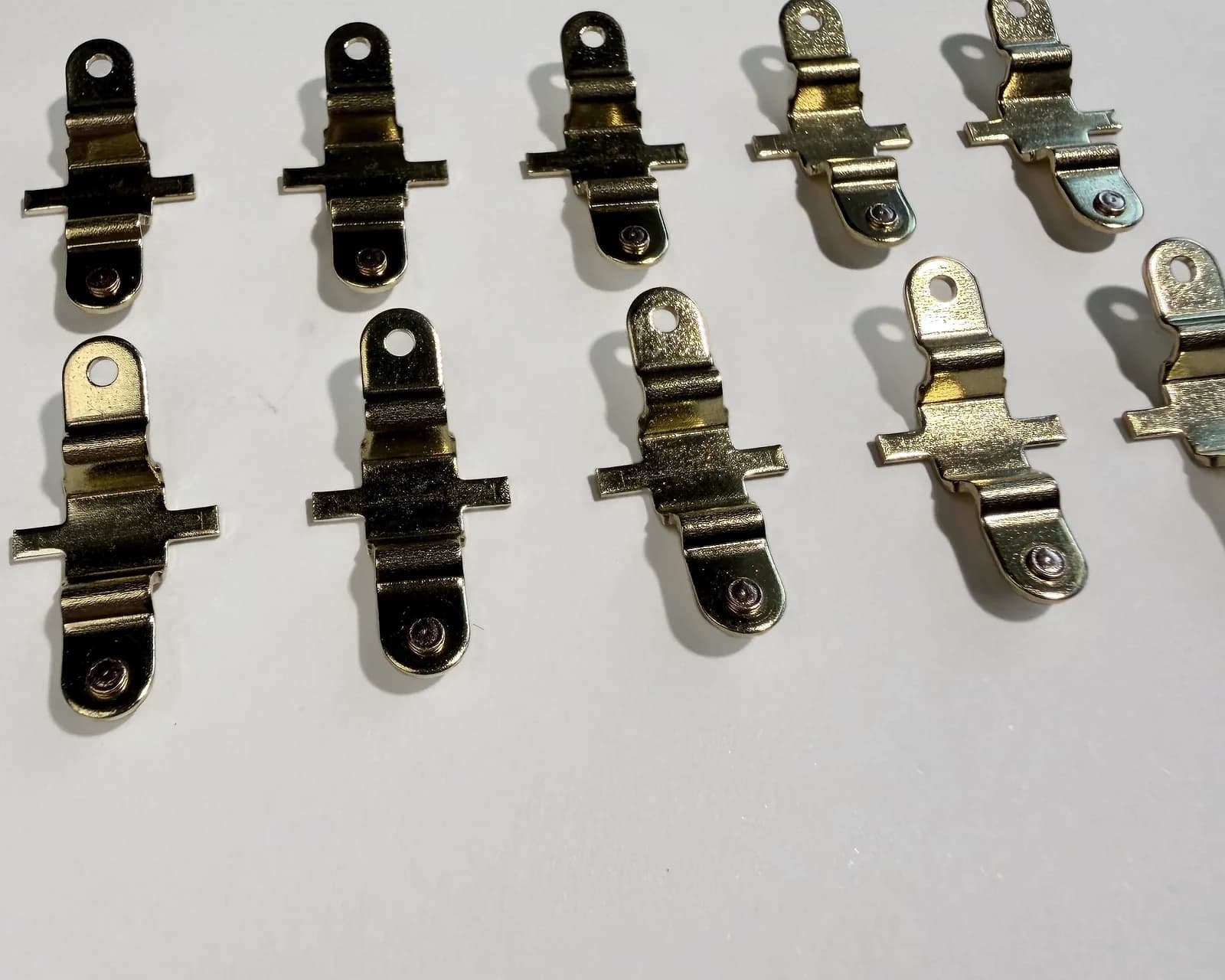 Photographed contact assemblies arranged for a sample review.